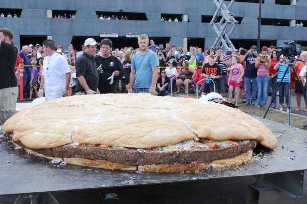 The largest hamburger in the world weighed 2,014 lbs, was 10 m in diameter, and took four cooks and a crane to make.