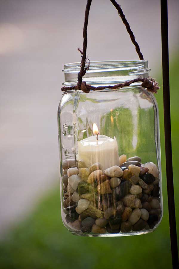 mason jar with candle and pebbles