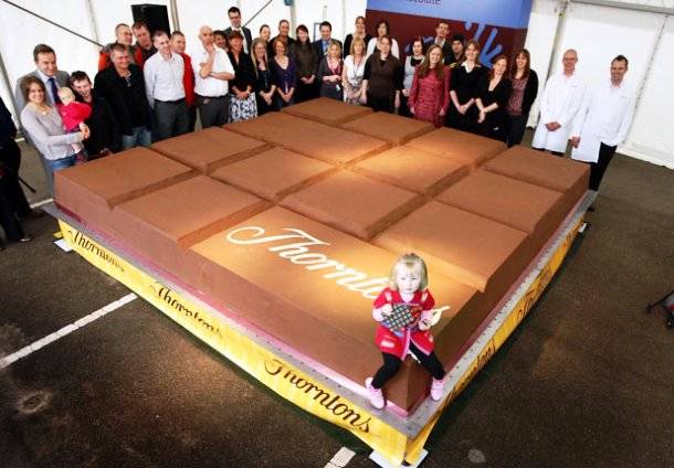 The largest chocolate bar weighed 12,770 lbs. Thorntons plc in Alfreton, Derbyshire, UK created it in October 2011.