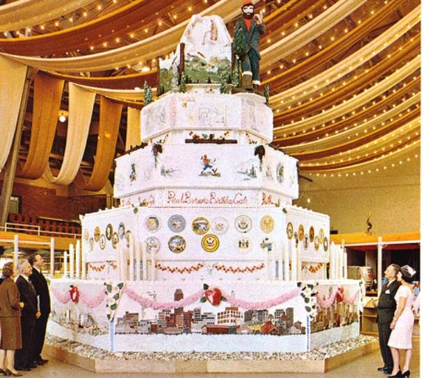 The worlds largest birthday cake weighed 25,000 lbs and stood 23 feet tall. It was made in 1962 for the Seattle Worlds Fair by Van De Kamp s Holland Dutch Bakers.