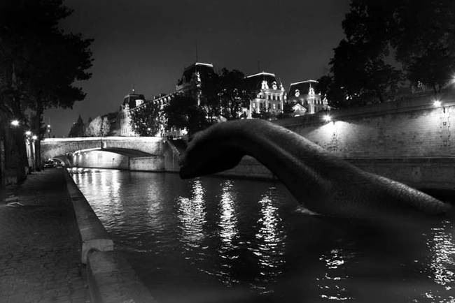 The Loch Ness Monster swimming in the Seine River.