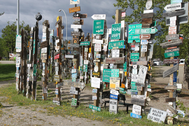 Street signs, license plates, and other markers from all over the world fill about two acres of the land.